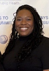 Headshot of Sequoia Rent, LGBTQ+ Commissioner, smiling in a black shirt.